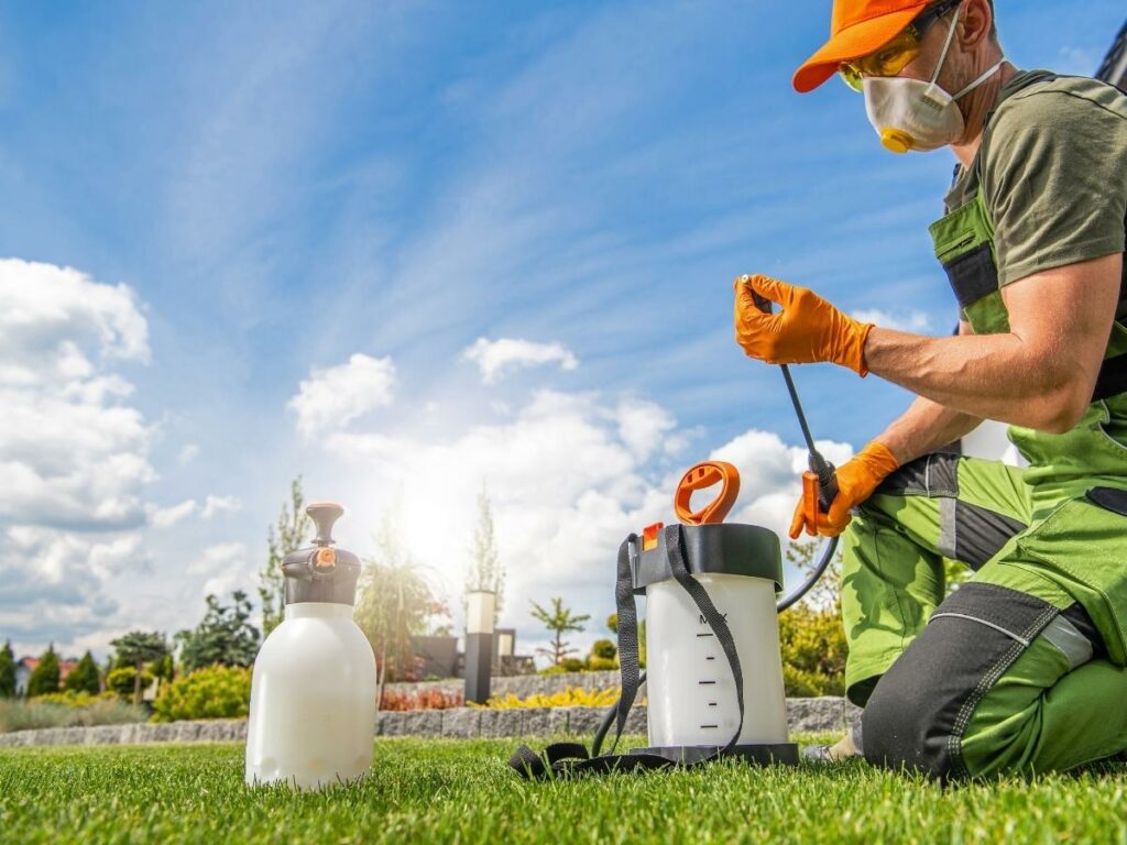 A commercial pest control opertion in the works, removing pests from a comapny lawn.